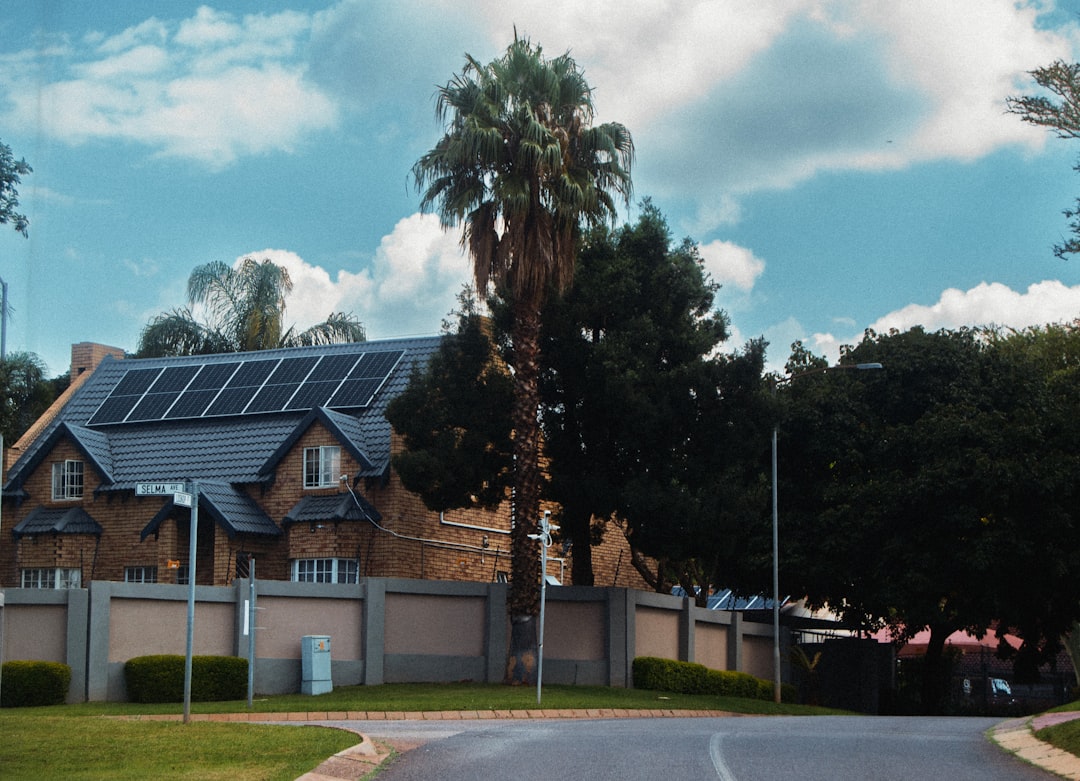 a-large-house-with-solar-panels-on-the-roof-f93lj-3womm
